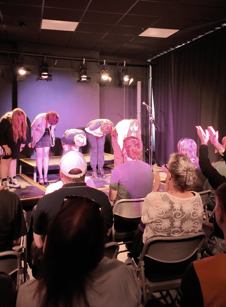 The Warren, Hull, performers bows while the audience clap